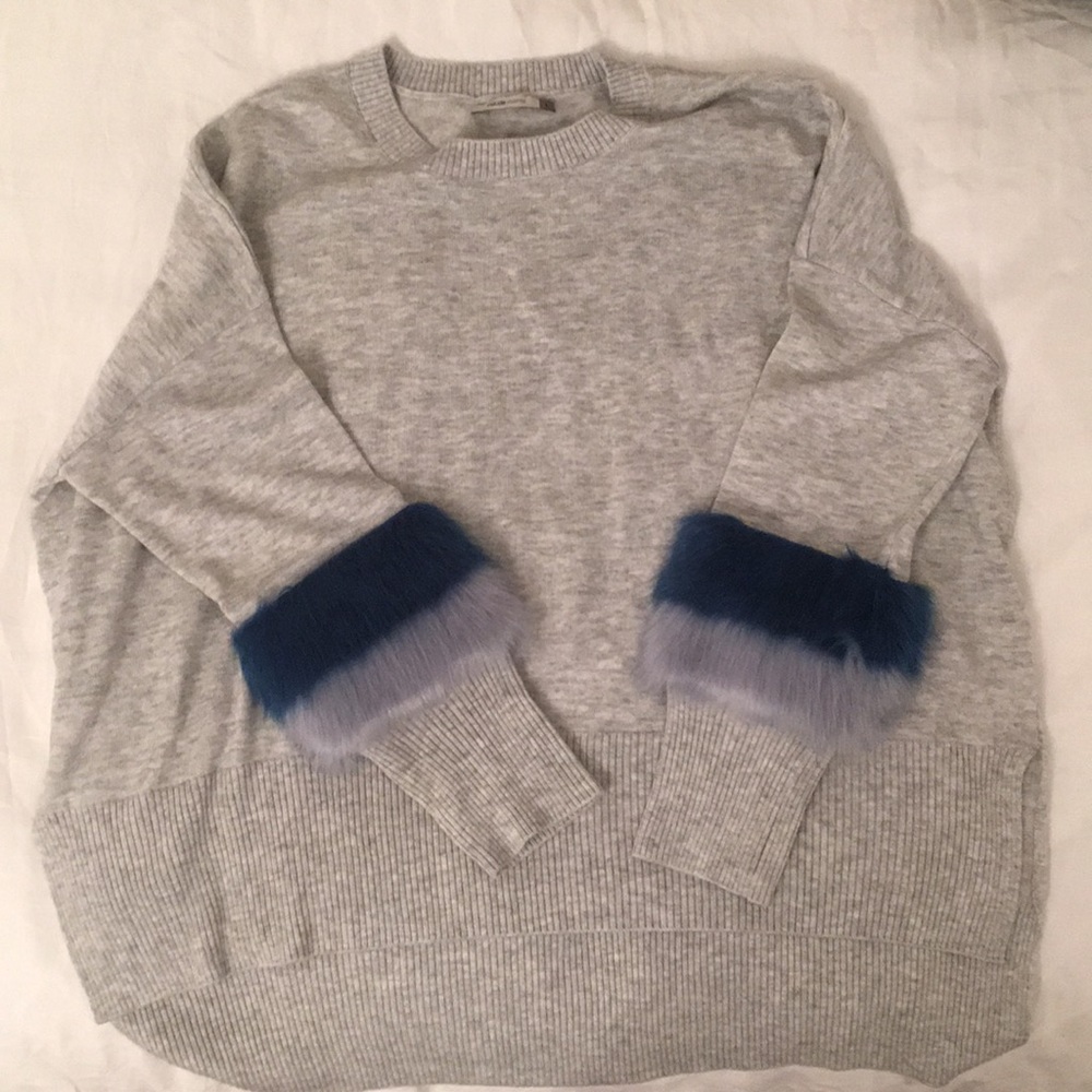 Soft grey sweater with cute details.